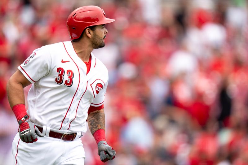 Aug 9, 2023; Cincinnati, OH, USA; Cincinnati Reds first baseman Christian Encarnacion-Strand (33) watches his ball leave the park after hitting a 2-run home run in the fourth inning of the MLB baseball game between Cincinnati Reds and Miami Marlins at Great American Ball Park in Cincinnati on Wednesday, Aug. 9, 2023.  Mandatory Credit: Albert Cesare-USA TODAY Sports