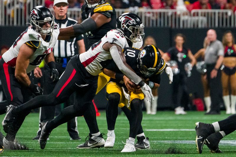 Atlanta Falcons linebacker Mike Jones Jr. (45) sacks Pittsburgh Steelers quarterback Mitch Trubisky (10) during the first half of an NFL preseason football game, Thursday, Aug. 24, 2023, in Atlanta. The Pittsburgh Steelers won 24-0. (AP Photo/Danny Karnik)