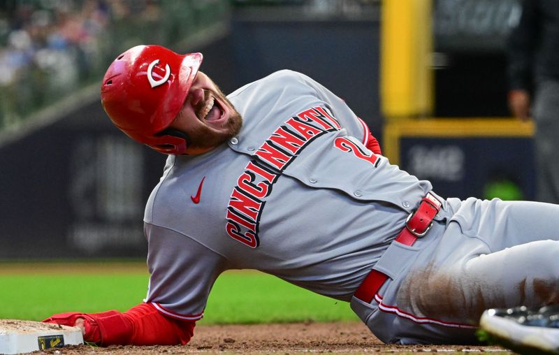 Apr 6, 2025; Milwaukee, Wisconsin, USA;  Cincinnati Reds left fielder Gavin Lux (2) reacts after being hit in the back on a pickoff attempt in the fourth inning against the Milwaukee Brewers at American Family Field. Mandatory Credit: Benny Sieu-Imagn Images