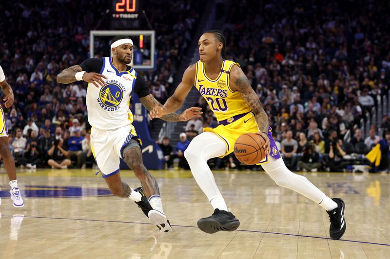 SAN FRANCISCO, CALIFORNIA - OCTOBER 18: Maxwell Lewis #20 of the Los Angeles Lakers is guarded by Gary Payton II #0 of the Golden State Warriors during the first half of their preseason game at Chase Center on October 18, 2024 in San Francisco, California.  NOTE TO USER: User expressly acknowledges and agrees that, by downloading and/or using this photograph, user is consenting to the terms and conditions of the Getty Images License Agreement.  (Photo by Ezra Shaw/Getty Images)