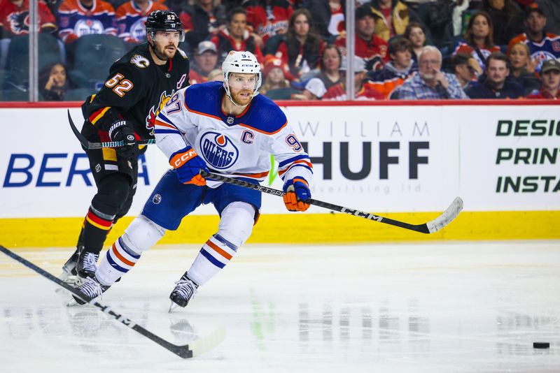 Apr 6, 2024; Calgary, Alberta, CAN; Edmonton Oilers center Connor McDavid (97) passes the puck against the Calgary Flames during the third period at Scotiabank Saddledome. Mandatory Credit: Sergei Belski-USA TODAY Sports