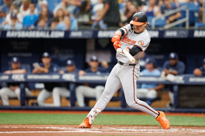 Jun 9, 2024; St. Petersburg, Florida, USA;  Baltimore Orioles shortstop Gunnar Henderson (2) doubles against the Tampa Bay Rays in the third inning at Tropicana Field. Mandatory Credit: Nathan Ray Seebeck-USA TODAY Sports