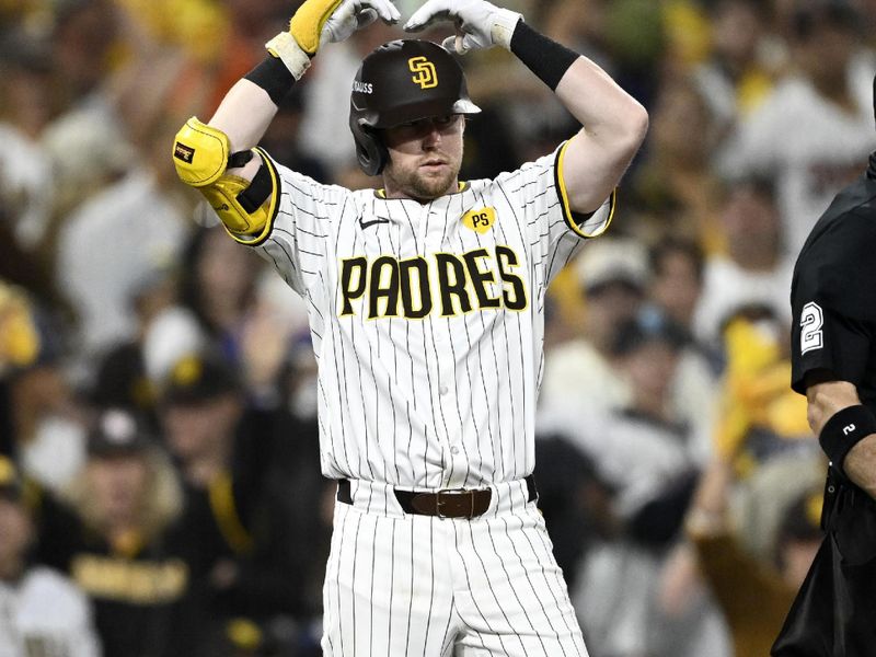 Oct 9, 2024; San Diego, California, USA; San Diego Padres first baseman Jake Cronenworth (9) celebrates after a triple in the seventh inning against the Los Angeles Dodgers during game four of the NLDS for the 2024 MLB Playoffs at Petco Park.  Mandatory Credit: Denis Poroy-Imagn Images