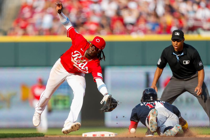 Jun 24, 2023; Cincinnati, Ohio, USA; Cincinnati Reds shortstop Elly De La Cruz (44) attempts to tag Atlanta Braves right fielder Ronald Acuna Jr. (13) out at second in the eighth inning at Great American Ball Park. Mandatory Credit: Katie Stratman-USA TODAY Sports