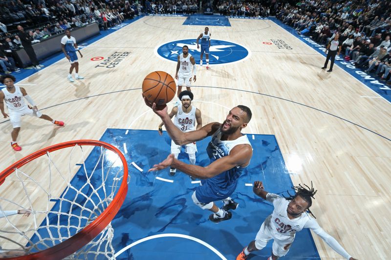 MINNEAPOLIS, MN -  MARCH 22: Rudy Gobert #27 of the Minnesota Timberwolves drives to the basket during the game against the Cleveland Cavaliers on March 22, 2024 at Target Center in Minneapolis, Minnesota. NOTE TO USER: User expressly acknowledges and agrees that, by downloading and or using this Photograph, user is consenting to the terms and conditions of the Getty Images License Agreement. Mandatory Copyright Notice: Copyright 2024 NBAE (Photo by David Sherman/NBAE via Getty Images)