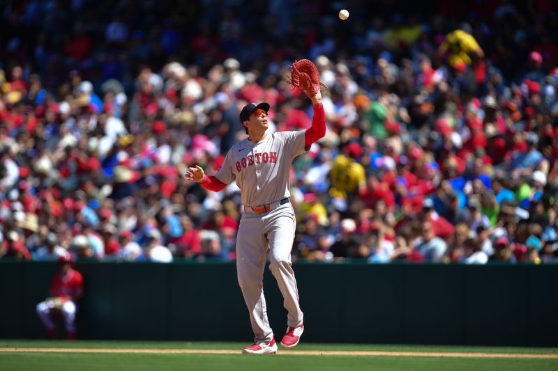 Apr 7, 2024; Anaheim, California, USA; Boston Red Sox first baseman Triston Casas (36) catches the fly ball of Los Angeles Angels shortstop Zach Neto (9) during the fifth inning at Angel Stadium. Mandatory Credit: Gary A. Vasquez-USA TODAY Sports