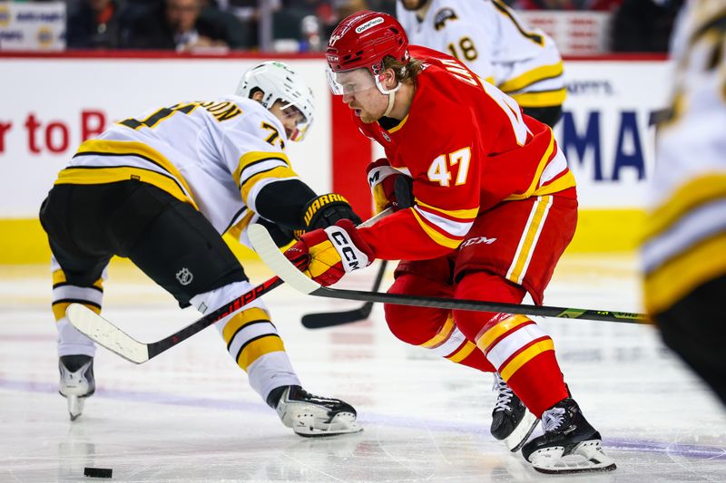 Dec 29, 2025; Calgary, Alberta, CAN; Calgary Flames center Connor Zary (47) controls the puck against the Boston Bruins during the second period at Scotiabank Saddledome. Mandatory Credit: Sergei Belski-Imagn Images