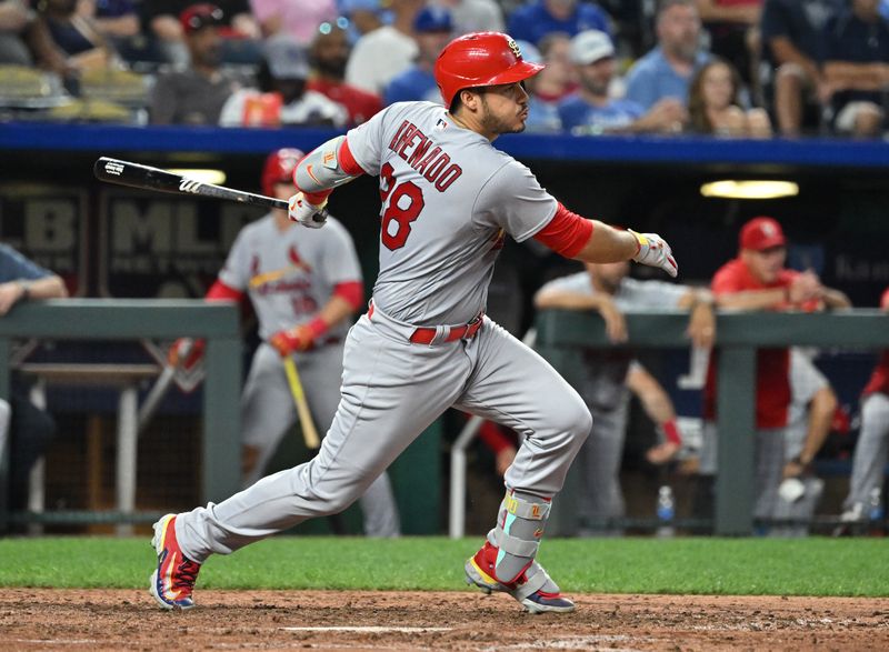 Aug 12, 2023; Kansas City, Missouri, USA;  St. Louis Cardinals third baseman Nolan Arenado (28) singles in the eighth inning against the Kansas City Royals at Kauffman Stadium. Mandatory Credit: Peter Aiken-USA TODAY Sports