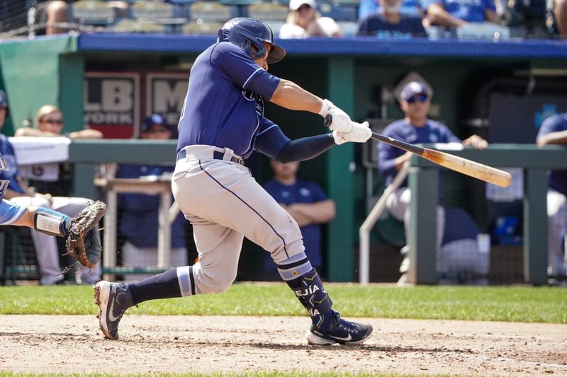 Jul 16, 2023; Kansas City, Missouri, USA; Tampa Bay Rays catcher Francisco Mejia (21) hits a three run home run against the Kansas City Royals in the eighth inning at Kauffman Stadium. Mandatory Credit: Denny Medley-USA TODAY Sports