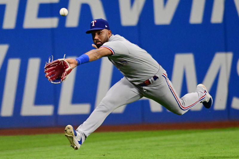 Sep 15, 2023; Cleveland, Ohio, USA; Texas Rangers left fielder Ezequiel Duran (21) can not make the catch of an RBI double hit by Cleveland Guardians first baseman Josh Naylor (not pictured) during the sixth inning at Progressive Field. Mandatory Credit: Ken Blaze-USA TODAY Sports