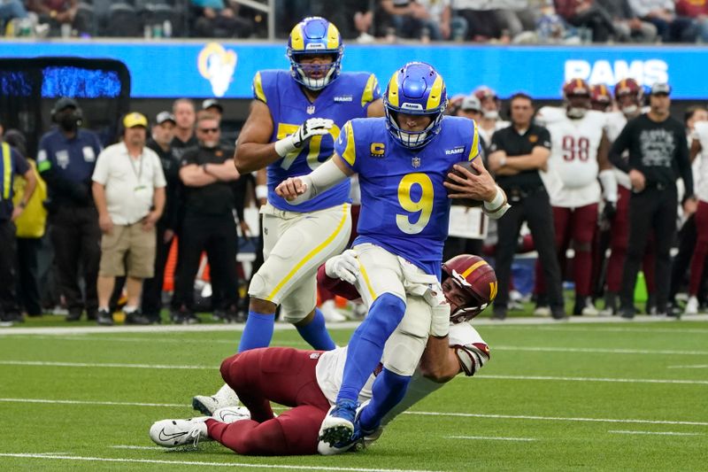 Washington Commanders defensive end Casey Toohill (95) tackles Los Angeles Rams quarterback Matthew Stafford (9) during the first half of an NFL football game Sunday, Dec. 17, 2023, in Inglewood, Calif. (AP Photo/Marcio Jose Sanchez)