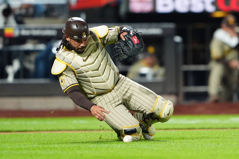 Jun 14, 2024; New York City, New York, USA; San Diego Padres catche Luis Campusano (12) fields a ground ball hit by New York Mets left fielder Brandon Nimmo (not pictured) for a base hit during the eighth inning at Citi Field. Mandatory Credit: Gregory Fisher-USA TODAY Sports