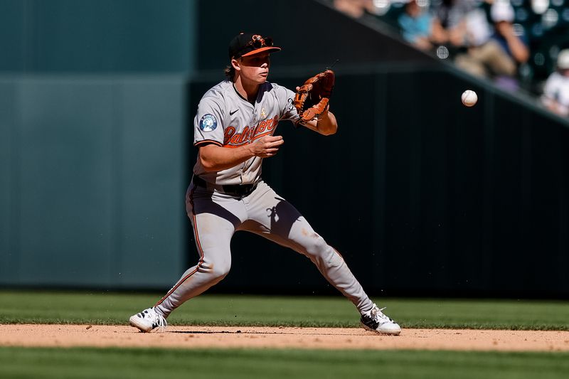 Sep 1, 2024; Denver, Colorado, USA; Baltimore Orioles second baseman Jackson Holliday (7) fields the ball in the ninth inning against the Colorado Rockies at Coors Field. Mandatory Credit: Isaiah J. Downing-USA TODAY Sports