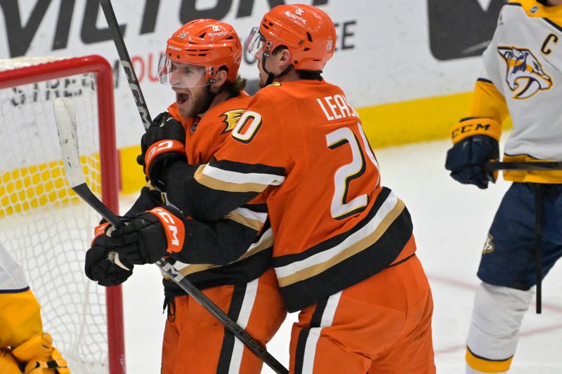 Jan 25, 2025; Anaheim, California, USA; Anaheim Ducks center Jansen Harkins (38),  is congratulated by right wing Brett Leason (20) after scoring a goal in the second period against the Nashville Predators at Honda Center. Mandatory Credit: Jayne Kamin-Oncea-Imagn Images