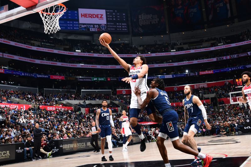 LOS ANGELES, CA - MARCH 1: Jordan Poole #13 of the Washington Wizards drives to the basket during the game against the LA Clippers on March 1, 2024 at Crypto.Com Arena in Los Angeles, California. NOTE TO USER: User expressly acknowledges and agrees that, by downloading and/or using this Photograph, user is consenting to the terms and conditions of the Getty Images License Agreement. Mandatory Copyright Notice: Copyright 2024 NBAE (Photo by Adam Pantozzi/NBAE via Getty Images)