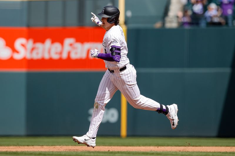 Apr 10, 2024; Denver, Colorado, USA; Colorado Rockies right fielder Michael Toglia (4) right fielder Michael Toglia (4) rounds the bases on a two run home run in the fourth inning against the Arizona Diamondbacks at Coors Field. Mandatory Credit: Isaiah J. Downing-USA TODAY Sports