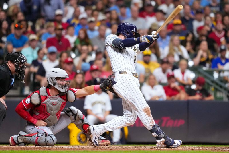 Sep 27, 2025; Milwaukee, Wisconsin, USA;  Milwaukee Brewers second baseman Brice Turang (2) hits an RBI double during the third inning against the Cincinnati Reds at American Family Field. Mandatory Credit: Jeff Hanisch-Imagn Images