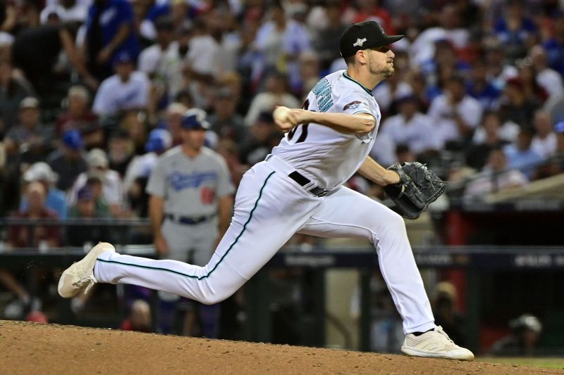 Oct 11, 2023; Phoenix, Arizona, USA; Arizona Diamondbacks relief pitcher Ryan Thompson (81) throws a pitch against the Los Angeles Dodgers in the sixth inning for game three of the NLDS for the 2023 MLB playoffs at Chase Field. Mandatory Credit: Matt Kartozian-USA TODAY Sports