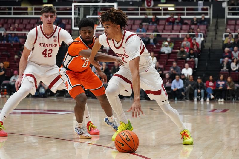 Jan 29, 2025; Stanford, California, USA;  Stanford Cardinal guard Oziyah Sellers (4) drives to the basket against Syracuse Orange guard Kyle Cuffe Jr. (0) as Stanford Cardinal forward Maxime Raynaud (42) looks on during the first half at Maples Pavilion. Mandatory Credit: David Gonzales-Imagn Images