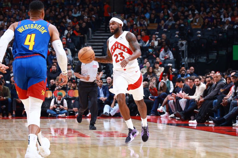 TORONTO, CANADA - OCTOBER 28: Jamal Shead #23 of the Toronto Raptors looks to pass the ball during the game against the Denver Nuggets on October 28, 2024 at the Scotiabank Arena in Toronto, Ontario, Canada.  NOTE TO USER: User expressly acknowledges and agrees that, by downloading and or using this Photograph, user is consenting to the terms and conditions of the Getty Images License Agreement.  Mandatory Copyright Notice: Copyright 2024 NBAE (Photo by Vaughn Ridley/NBAE via Getty Images)