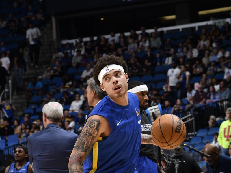 ORLANDO, FL - MARCH 27: Lester Quinones #25 of the Golden State Warriors warms up against the Orlando Magic on March 27, 2024 at Amway Center in Orlando, Florida. NOTE TO USER: User expressly acknowledges and agrees that, by downloading and or using this photograph, User is consenting to the terms and conditions of the Getty Images License Agreement. Mandatory Copyright Notice: Copyright 2024 NBAE (Photo by Fernando Medina/NBAE via Getty Images)
