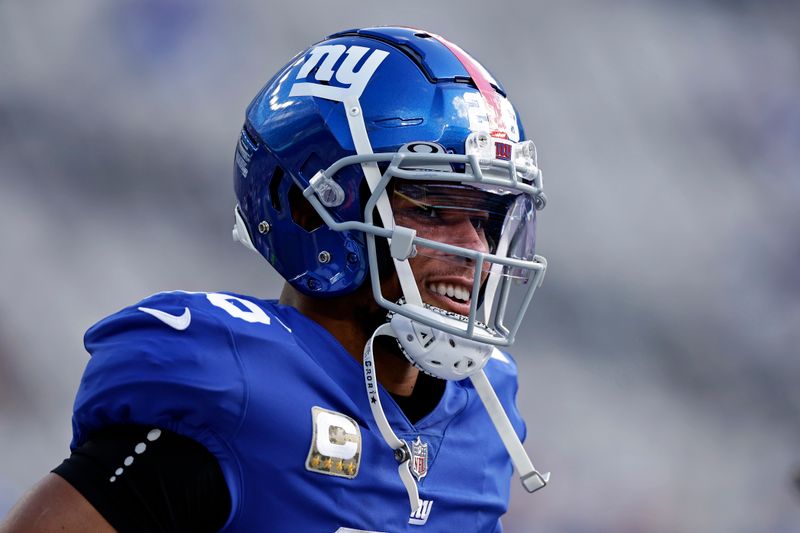 New York Giants running back Saquon Barkley (26) warms up before an NFL football game against the Houston Texans on Sunday, Nov. 13, 2022, in East Rutherford, N.J. (AP Photo/Adam Hunger)