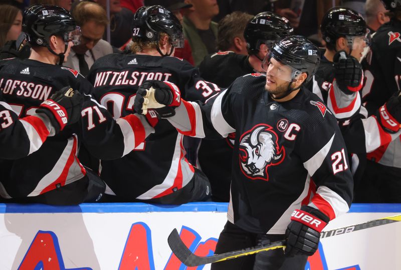 Dec 9, 2023; Buffalo, New York, USA;  Buffalo Sabres right wing Kyle Okposo (21) celebrates his goal with teammates during the third period against the Montreal Canadiens at KeyBank Center. Mandatory Credit: Timothy T. Ludwig-USA TODAY Sports