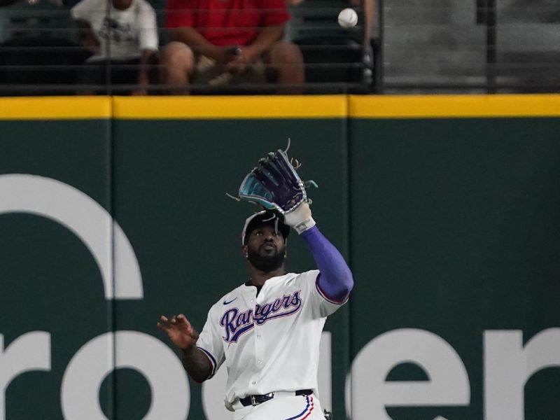 May 17, 2025; Arlington, Texas, USA; Texas Rangers outfielder Adolis García (53) makes a catch during the ninth inning against the Houston Astros at Globe Life Field. Mandatory Credit: Raymond Carlin III-Imagn Images