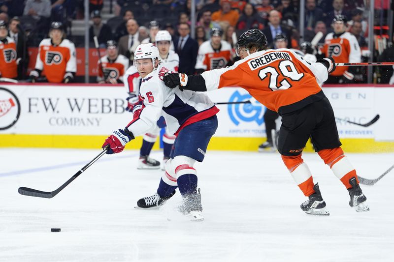 Mar 11, 2026; Philadelphia, Pennsylvania, USA; Washington Capitals defenseman Jakob Chychrun (6) passes the puck against Philadelphia Flyers right wing Nikita Grebenkin (29) in the third period at Xfinity Mobile Arena. Mandatory Credit: Kyle Ross-Imagn Images