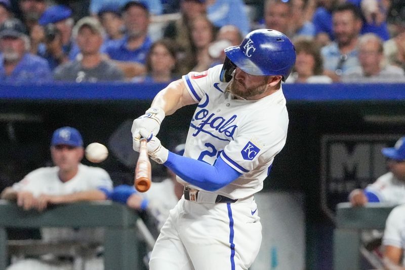 Sep 16, 2024; Kansas City, Missouri, USA; Kansas City Royals center fielder Kyle Isbel (28) hits a triple against the Detroit Tigers in the fifth inning at Kauffman Stadium. Mandatory Credit: Denny Medley-Imagn Images