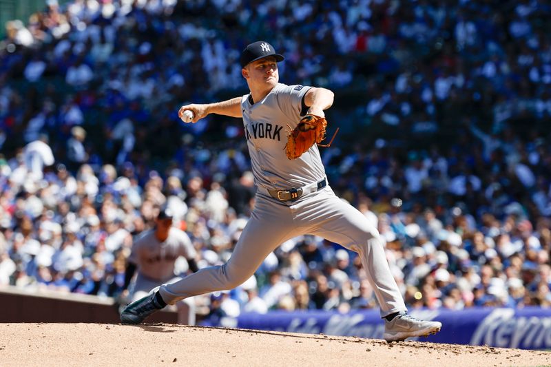 Sep 7, 2024; Chicago, Illinois, USA; New York Yankees starting pitcher Clarke Schmidt (36) delivers a pitch against the Chicago Cubs during the first inning at Wrigley Field. Mandatory Credit: Kamil Krzaczynski-Imagn Images