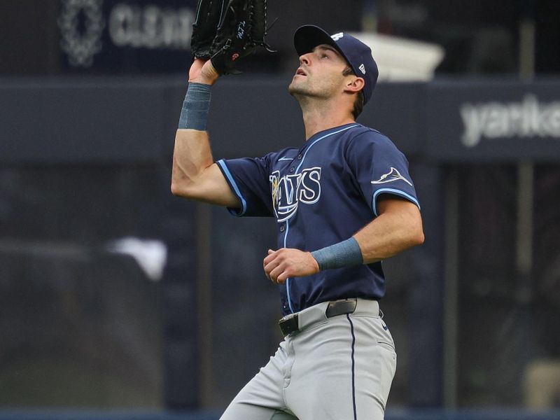 May 4, 2025; Bronx, New York, USA; Tampa Bay Rays right fielder Kameron Misner (26) makes a catch for an out on a ball hit by New York Yankees first baseman Paul Goldschmidt (not pictured) during the fourth inning at Yankee Stadium. Mandatory Credit: Vincent Carchietta-Imagn Images