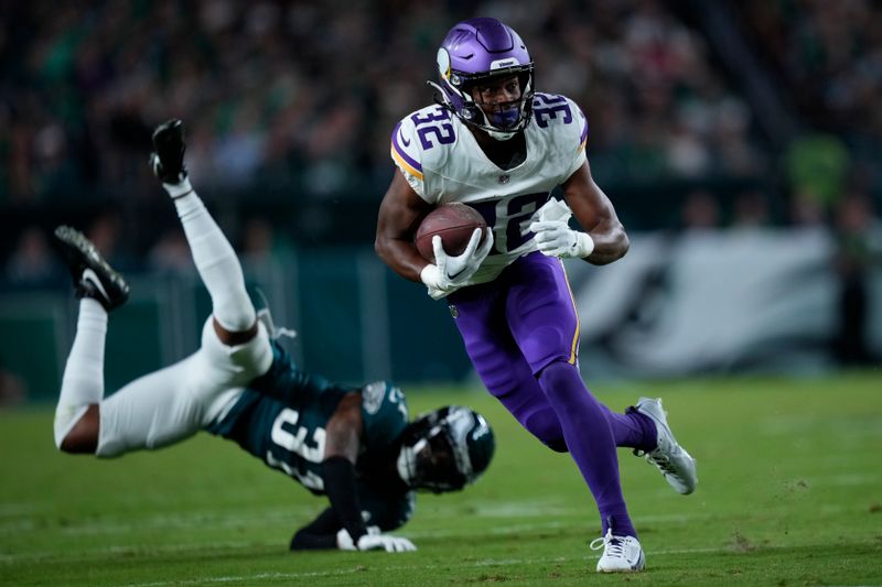 Minnesota Vikings running back Ty Chandler (32) runs with the ball during the second half of an NFL football game against the Philadelphia Eagles on Thursday, Sept. 14, 2023, in Philadelphia. (AP Photo/Matt Slocum)