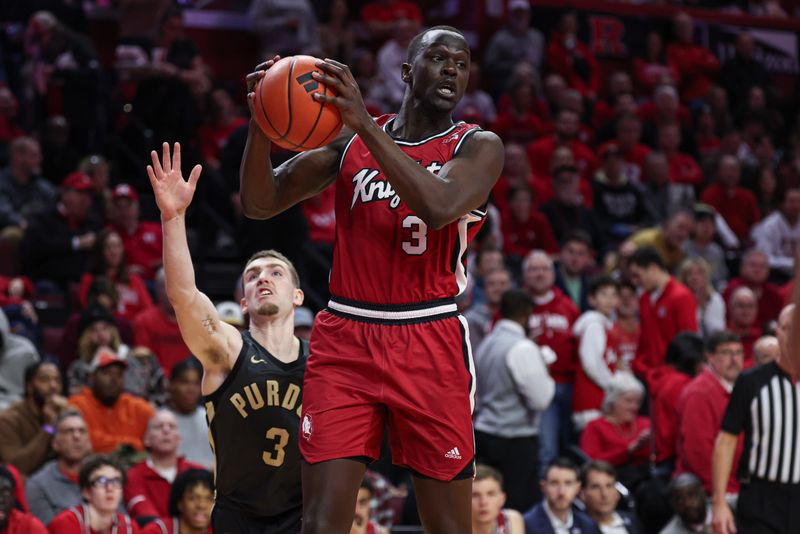 Jan 28, 2024; Piscataway, New Jersey, USA; Rutgers Scarlet Knights forward Mawot Mag (3) rebounds in front of Purdue Boilermakers guard Braden Smith (3) during the second half at Jersey Mike's Arena. Mandatory Credit: Vincent Carchietta-USA TODAY Sports