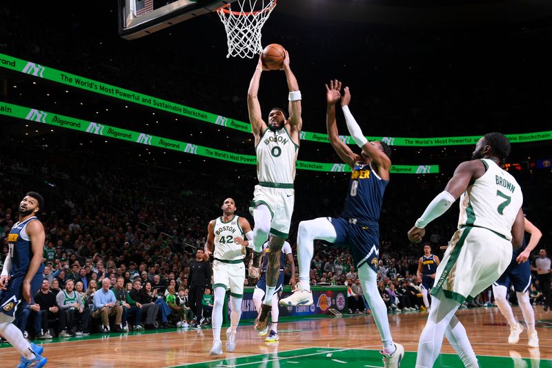 BOSTON, MA - JANUARY 19:  Jayson Tatum #0 of the Boston Celtics dunks the ball during the game against the Denver Nuggets on January 19, 2024 at the TD Garden in Boston, Massachusetts. NOTE TO USER: User expressly acknowledges and agrees that, by downloading and or using this photograph, User is consenting to the terms and conditions of the Getty Images License Agreement. Mandatory Copyright Notice: Copyright 2024 NBAE  (Photo by Brian Babineau/NBAE via Getty Images)