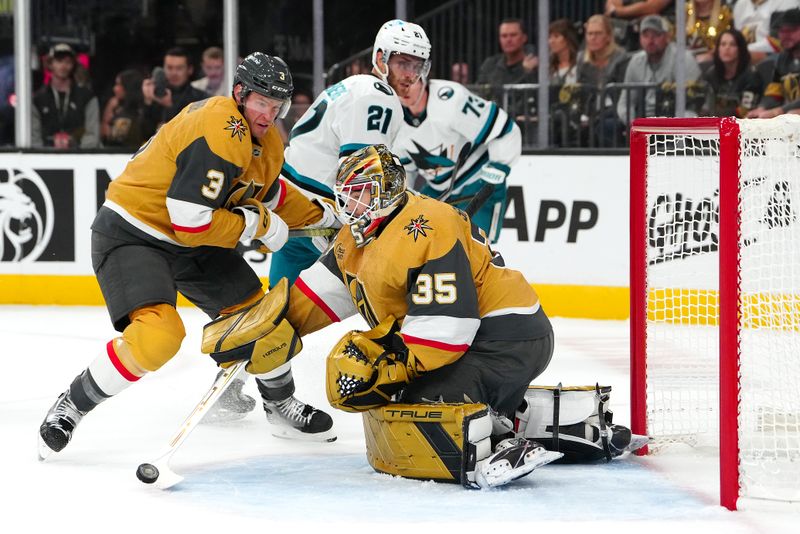 Oct 26, 2024; Las Vegas, Nevada, USA; Vegas Golden Knights goaltender Ilya Samsonov (35) deflects a shot by the San Jose Sharks as Vegas Golden Knights defenseman Brayden McNabb (3) clears San Jose Sharks center Alexander Wennberg (21) during the first period at T-Mobile Arena. Mandatory Credit: Stephen R. Sylvanie-Imagn Images