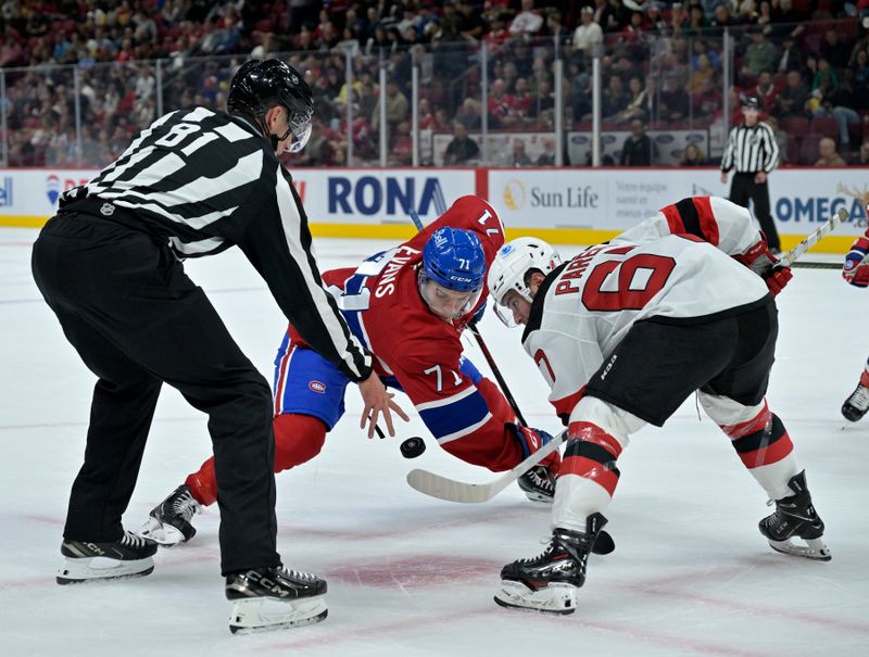 Sep 24, 2024; Montreal, Quebec, CAN; Faceoff between Montreal Canadiens forward Jake Evans (71) and New Jersey Devils forward Xavier Parent (67) during the first period at the Bell Centre. Mandatory Credit: Eric Bolte-Imagn Images