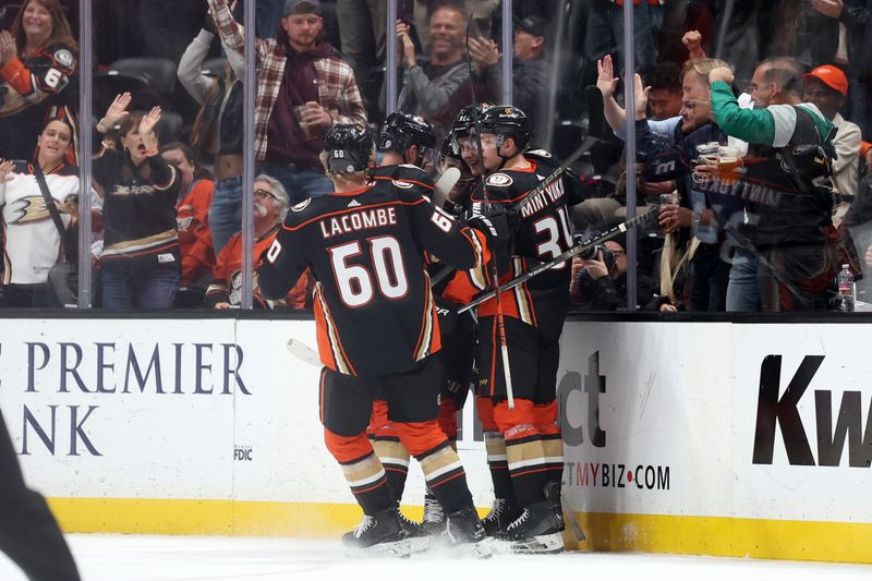 Nov 10, 2023; Anaheim, California, USA; Anaheim Ducks center Leo Carlsson (91) celebrates with teammates after scoring a second goal of the game during the third period against the Philadelphia Flyers at Honda Center. Mandatory Credit: Kiyoshi Mio-USA TODAY Sports