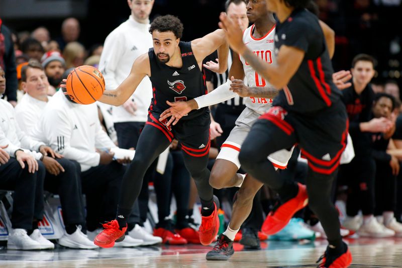 Jan 3, 2024; Columbus, Ohio, USA; Rutgers Scarlet Knights guard Noah Fernandes (2) dribbles up court as Ohio State Buckeyes guard Scotty Middleton (0) defends during the first half at Value City Arena. Mandatory Credit: Joseph Maiorana-USA TODAY Sports