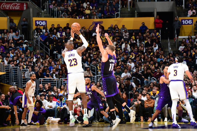 LOS ANGELES, CA - OCTOBER 26: LeBron James #23 of the Los Angeles Lakers shoots a three point basket during the game against the Sacramento Kings on October 26, 2024 at Crypto.Com Arena in Los Angeles, California. NOTE TO USER: User expressly acknowledges and agrees that, by downloading and/or using this Photograph, user is consenting to the terms and conditions of the Getty Images License Agreement. Mandatory Copyright Notice: Copyright 2024 NBAE (Photo by Adam Pantozzi/NBAE via Getty Images)