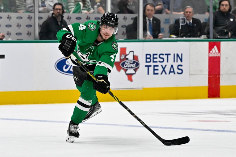 Nov 14, 2023; Dallas, Texas, USA; Dallas Stars defenseman Miro Heiskanen (4) passes the puck in the Arizona Coyotes zone during the second period at the American Airlines Center. Mandatory Credit: Jerome Miron-USA TODAY Sports