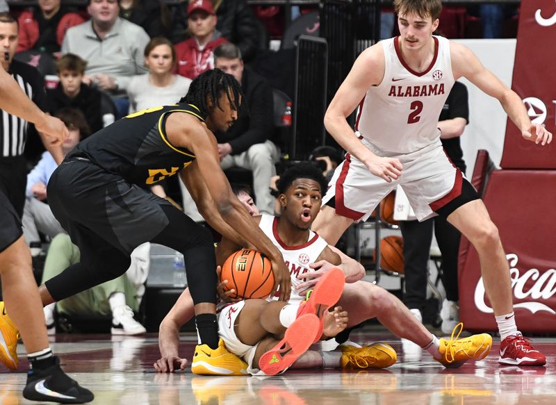 Jan 16, 2024; Tuscaloosa, Alabama, USA; Missouri forward Aidan Shaw (23) and Alabama forward Mouhamed Dioubate (10) struggle for control of the ball on the floor in the game at Coleman Coliseum. Mandatory Credit: Gary Cosby Jr.-USA TODAY Sports