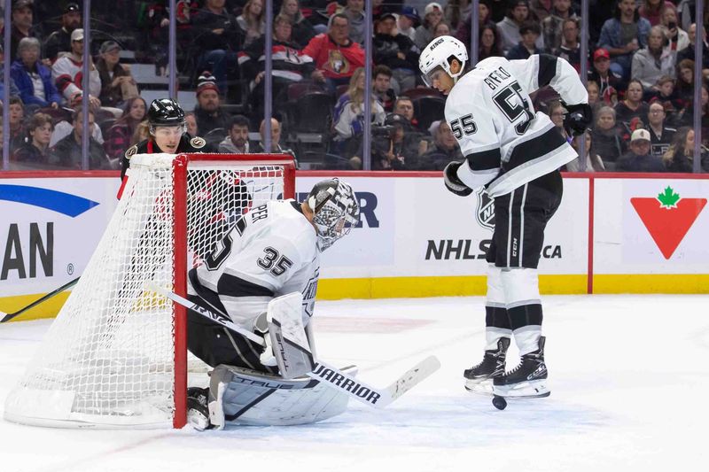 Oct 1 4, 2024; Ottawa, Ontario, CAN; Los Angeles Kings goalie Darcy Kuemper (35) makes a save in the first period against the Ottawa Senators at the Canadian Tire Centre. Mandatory Credit: Marc DesRosiers-Imagn Images