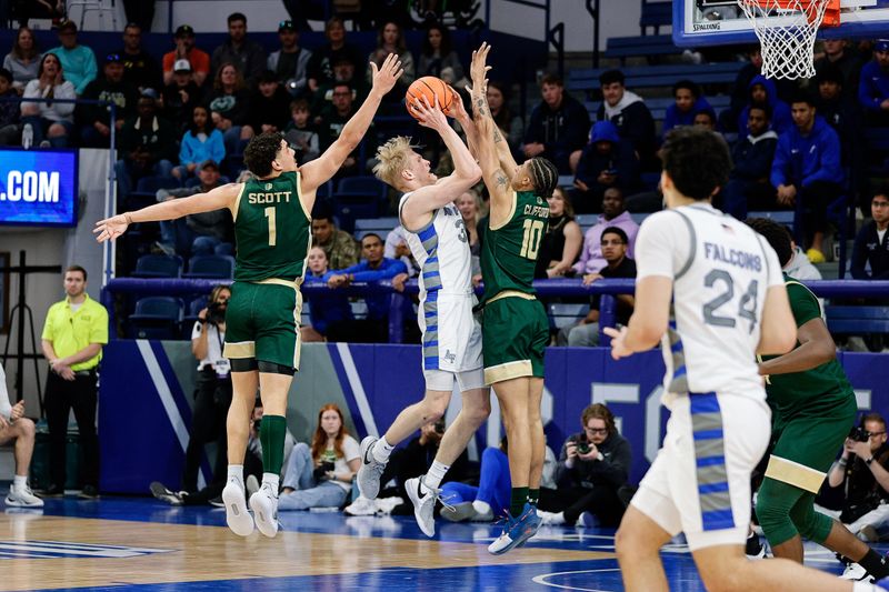 Mar 9, 2024; Colorado Springs, Colorado, USA; Air Force Falcons forward Rytis Petraitis (31) attempts a shot against Colorado State Rams guard Nique Clifford (10) and forward Joel Scott (1) in the first half at Clune Arena. Mandatory Credit: Isaiah J. Downing-USA TODAY Sports