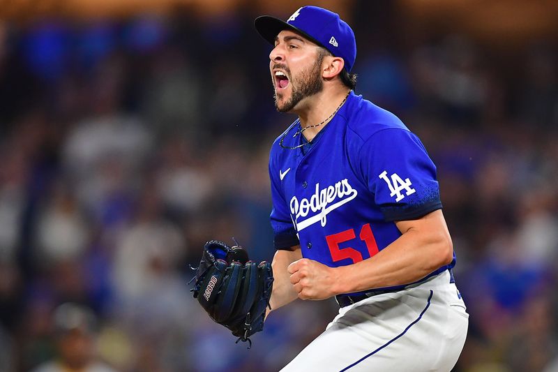 Jul 6, 2023; Los Angeles, California, USA; Los Angeles Dodgers relief pitcher Alex Vesia (51) celebrates the victory against the Pittsburgh Pirates at Dodger Stadium. Mandatory Credit: Gary A. Vasquez-USA TODAY Sports