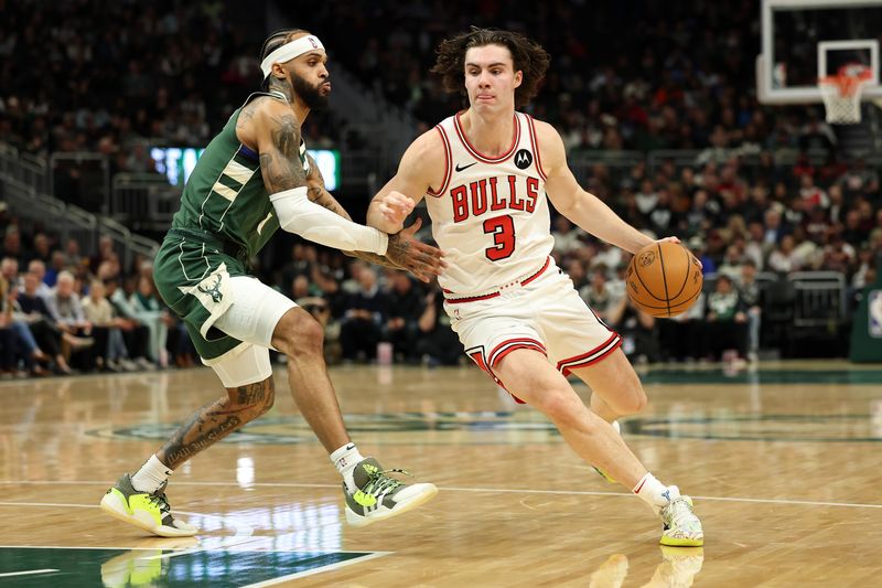 MILWAUKEE, WISCONSIN - NOVEMBER 20: Josh Giddey #3 of the Chicago Bulls drives around Gary Trent Jr. #5 of the Milwaukee Bucks during the first half of a game at Fiserv Forum on November 20, 2024 in Milwaukee, Wisconsin. NOTE TO USER: User expressly acknowledges and agrees that, by downloading and or using this photograph, User is consenting to the terms and conditions of the Getty Images License Agreement. (Photo by Stacy Revere/Getty Images)