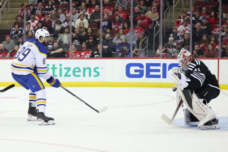 Oct 27, 2023; Newark, New Jersey, USA; New Jersey Devils goaltender Vitek Vanecek (41) makes a save against Buffalo Sabres right wing Alex Tuch (89) during the second period at Prudential Center. Mandatory Credit: Vincent Carchietta-USA TODAY Sports