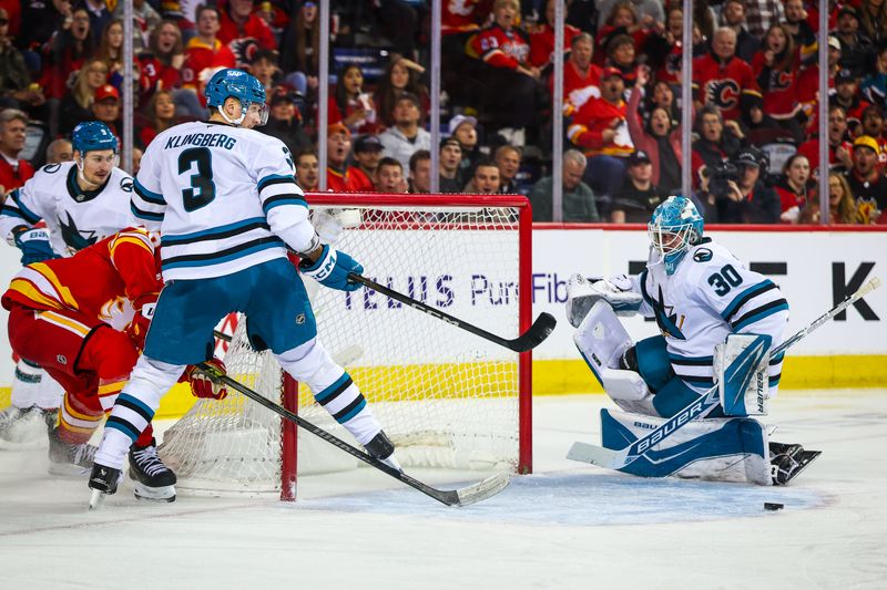 Nov 13, 2025; Calgary, Alberta, CAN; San Jose Sharks goaltender Yaroslav Askarov (30) guards his net against the Calgary Flames during the second period at Scotiabank Saddledome. Mandatory Credit: Sergei Belski-Imagn Images