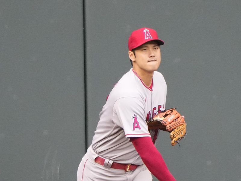 Apr 14, 2022; Arlington, Texas, USA; Los Angeles Angels starting pitcher Shohei Ohtani (17) warms up during team practice before a baseball game against the Texas Rangers at Globe Life Field. Mandatory Credit: Jim Cowsert-USA TODAY Sports