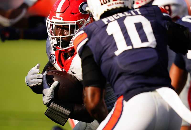 Sep 30, 2023; Auburn, Alabama, USA; Georgia Bulldogs running back Daijun Edwards (30) carries for a touchdown against the Auburn Tigers during the third quarter at Jordan-Hare Stadium. Mandatory Credit: John David Mercer-USA TODAY Sports